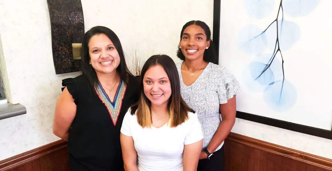 The welcoming front-desk team at Seguin Family Medical Center